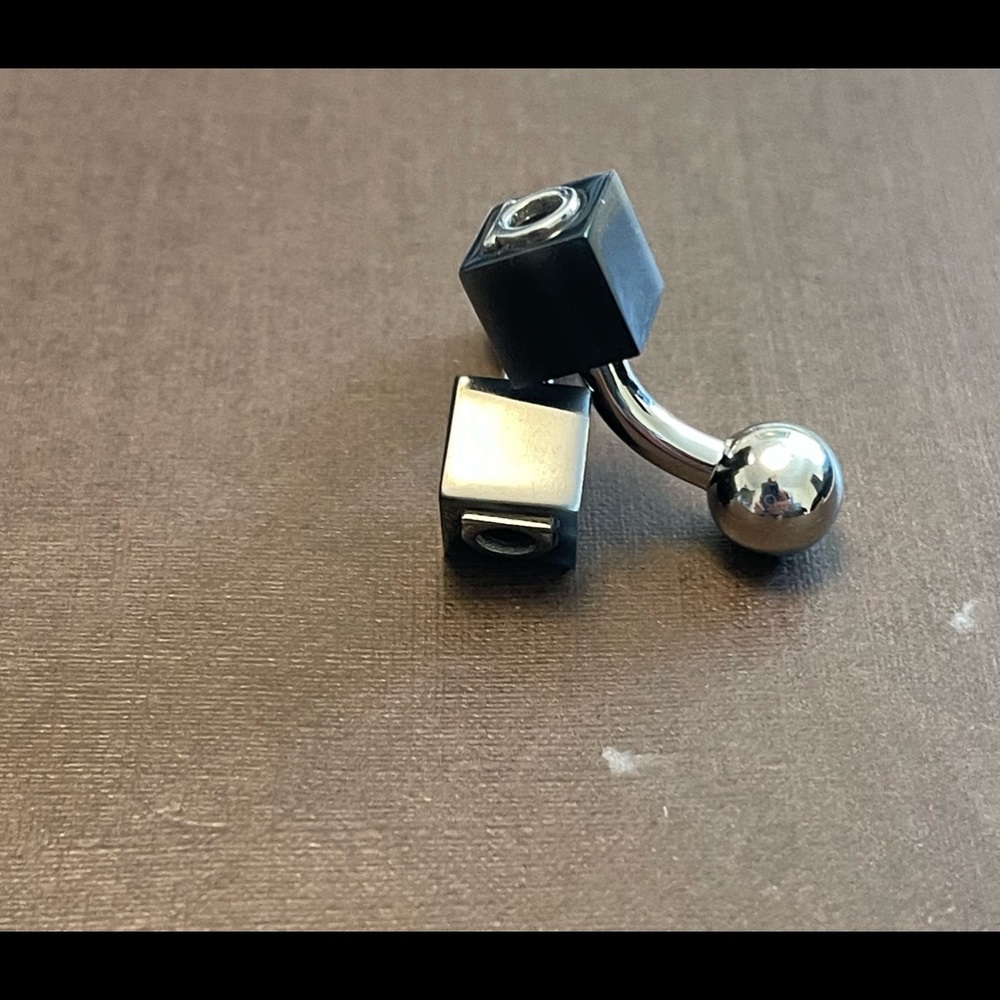 Pair of Salvatore ferragamo cuff links stainless steel and black w logo